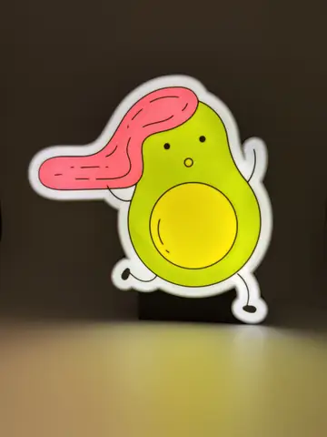 Custom avocado lightbox on a dark background.